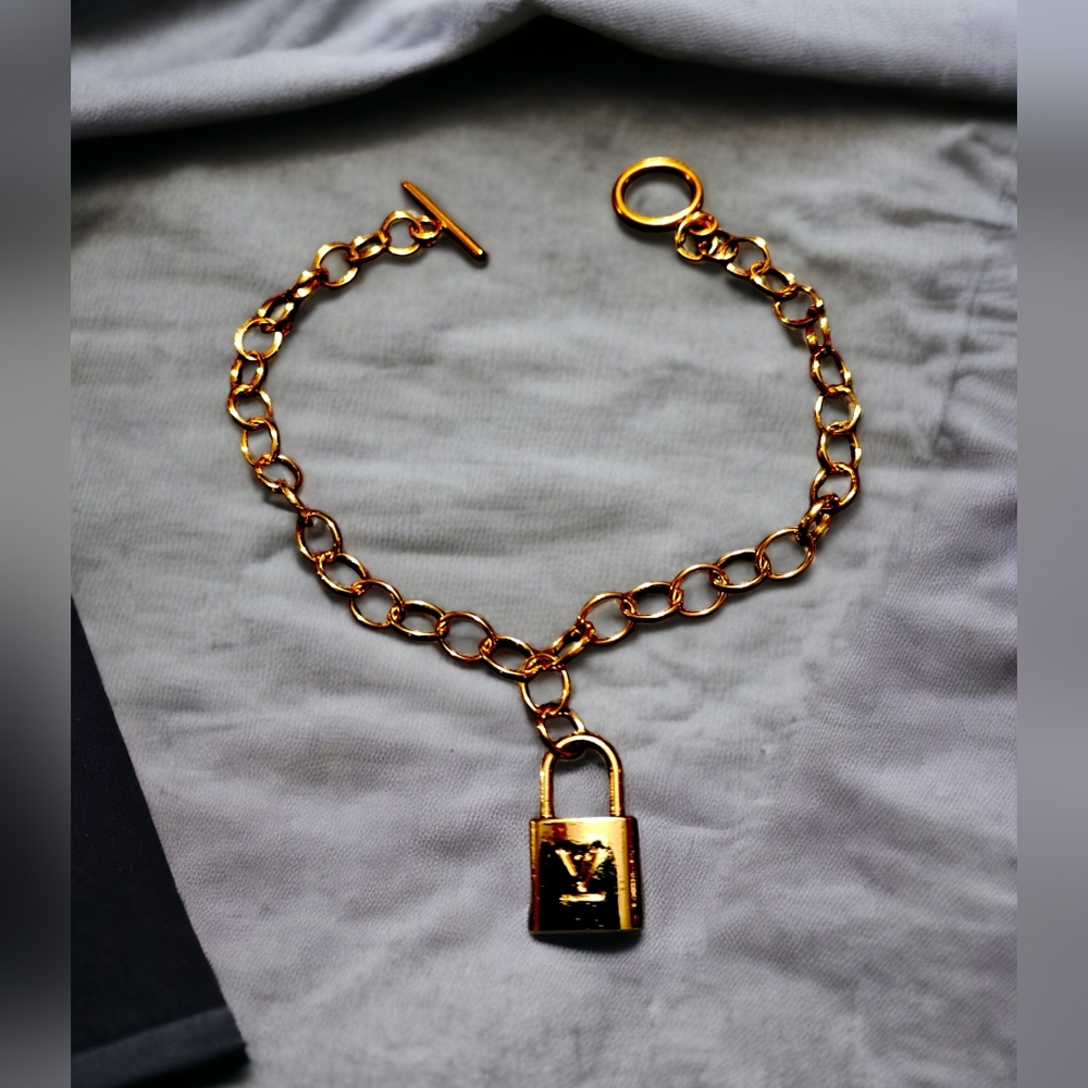 Petite lock on a stainless steel gold plated bracelet
